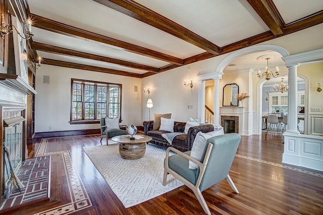 4927 Lake Ave, White Bear Lake, MN 55110 - living area featuring arched walkways, a glass covered fireplace, decorative columns, wood finished floors, and beamed ceiling