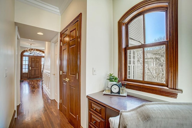 4927 Lake Ave, White Bear Lake, MN 55110 - hall with crown molding, baseboards, dark wood-type flooring, and an inviting chandelier