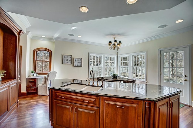 4927 Lake Ave, White Bear Lake, MN 55110 - kitchen with an inviting chandelier, a sink, dark wood-type flooring, and a kitchen island with sink