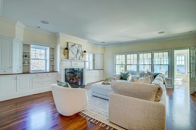 4927 Lake Ave, White Bear Lake, MN 55110 - living area with visible vents, a high end fireplace, dark wood finished floors, and ornamental molding
