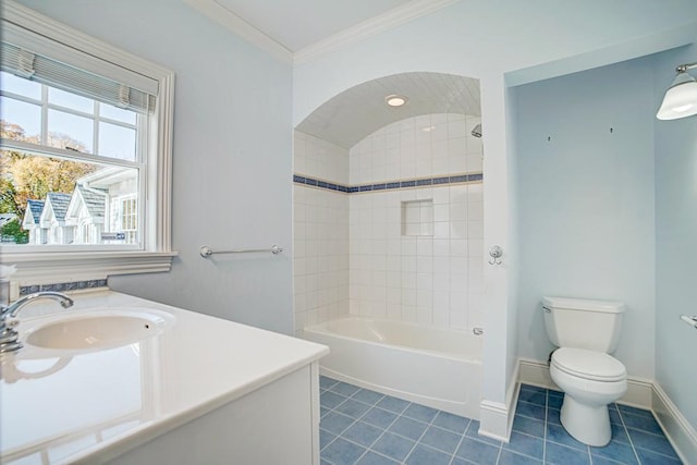 4927 Lake Ave, White Bear Lake, MN 55110 - full bathroom featuring ornamental molding, toilet, baseboards, washtub / shower combination, and tile patterned floors