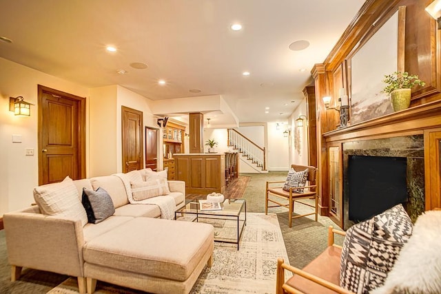 4927 Lake Ave, White Bear Lake, MN 55110 - living room with light colored carpet, stairs, recessed lighting, baseboards, and decorative columns