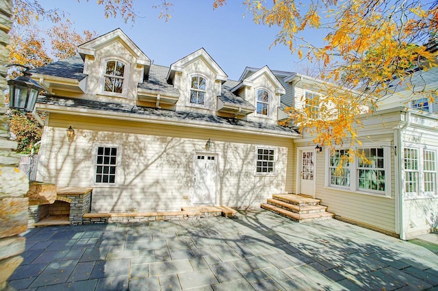 4927 Lake Ave, White Bear Lake, MN 55110 - back of property featuring a high end roof and a patio area
