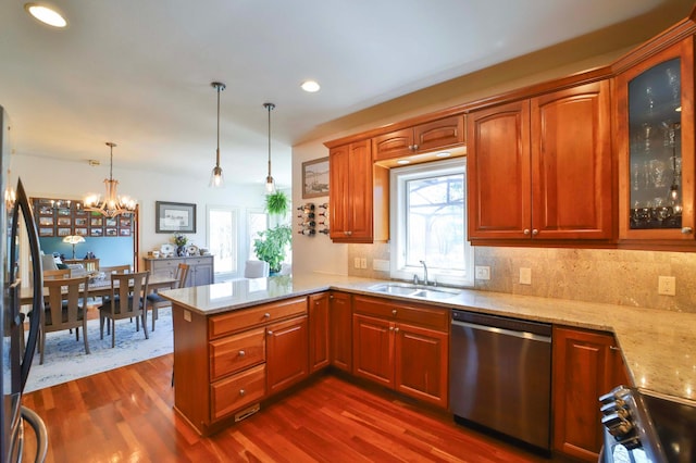 6203 Fairfax Ct, Baxter, MN 56425 - kitchen featuring dishwasher, a sink, a peninsula, light stone counters, and healthy amount of natural light