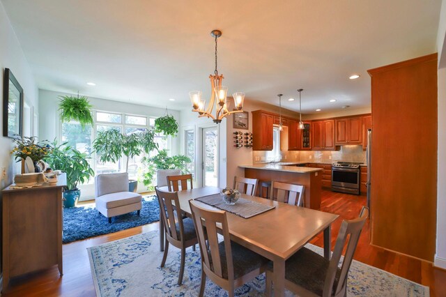 6203 Fairfax Ct, Baxter, MN 56425 - dining space with dark wood finished floors, recessed lighting, and a chandelier