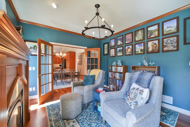 6203 Fairfax Ct, Baxter, MN 56425 - sitting room with a chandelier, baseboards, wood finished floors, and ornamental molding