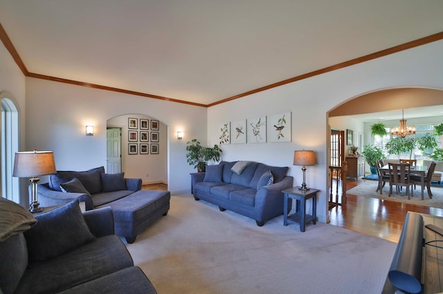6203 Fairfax Ct, Baxter, MN 56425 - living area featuring arched walkways, a chandelier, ornamental molding, and light carpet