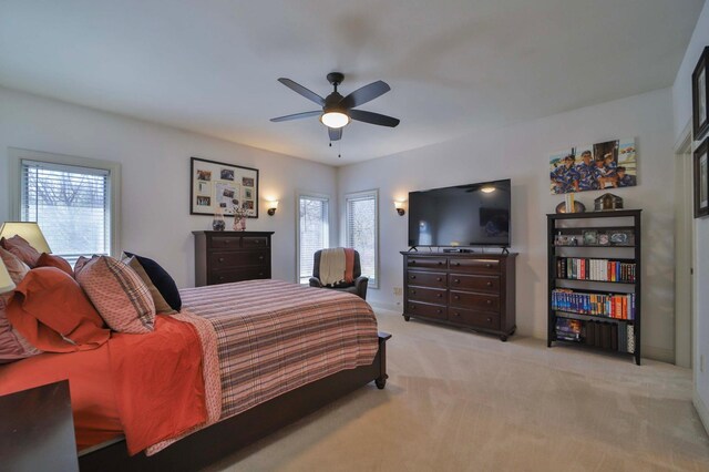 6203 Fairfax Ct, Baxter, MN 56425 - bedroom with multiple windows, light carpet, and a ceiling fan