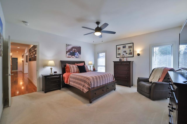 6203 Fairfax Ct, Baxter, MN 56425 - bedroom featuring light colored carpet and ceiling fan