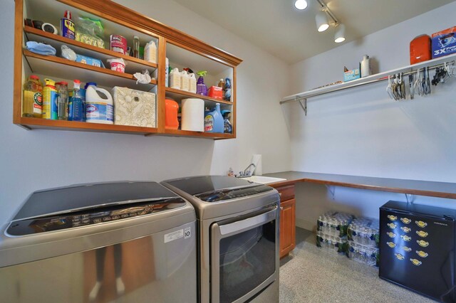 6203 Fairfax Ct, Baxter, MN 56425 - laundry room featuring washer and dryer and cabinet space