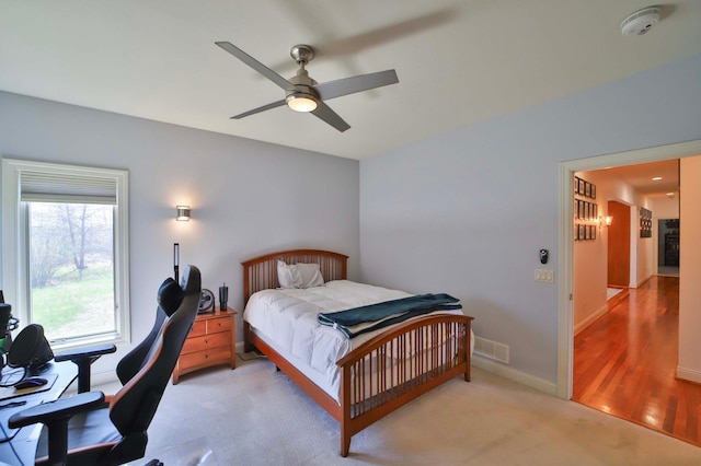 6203 Fairfax Ct, Baxter, MN 56425 - bedroom with ceiling fan, baseboards, and light colored carpet