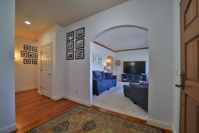 6203 Fairfax Ct, Baxter, MN 56425 - hall with arched walkways, wood finished floors, baseboards, and recessed lighting