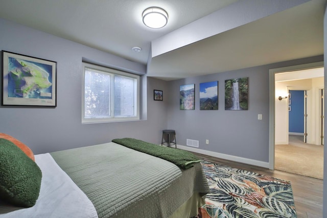 6203 Fairfax Ct, Baxter, MN 56425 - bedroom with wood finished floors and baseboards