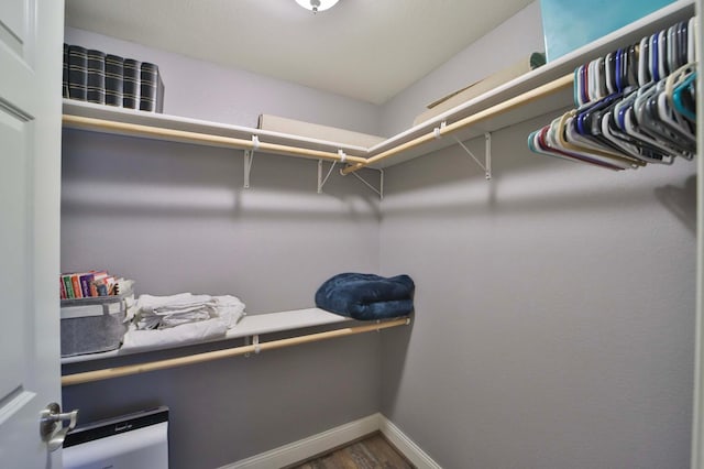 6203 Fairfax Ct, Baxter, MN 56425 - walk in closet featuring dark wood-style floors