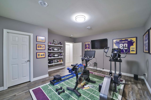 6203 Fairfax Ct, Baxter, MN 56425 - workout area featuring baseboards and wood finished floors