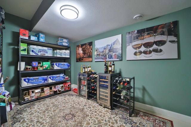 6203 Fairfax Ct, Baxter, MN 56425 - recreation room with a dry bar, baseboards, and beverage cooler