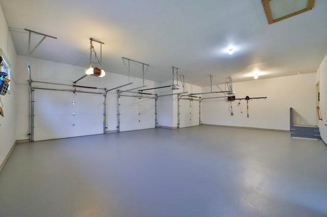 6203 Fairfax Ct, Baxter, MN 56425 - garage featuring a garage door opener