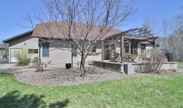 6203 Fairfax Ct, Baxter, MN 56425 - back of property featuring a pergola, a lawn, and a patio area
