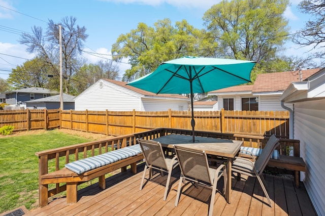 wooden terrace with outdoor dining space