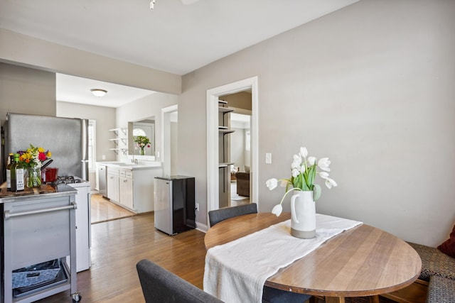 dining space with light wood-style floors