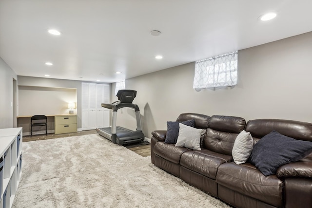 living area with recessed lighting and wood finished floors