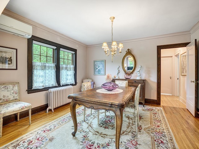 2292 Valentine Ave, Saint Paul, MN 55108 - dining area with radiator heating unit, an AC wall unit, light wood-style floors, a chandelier, and crown molding