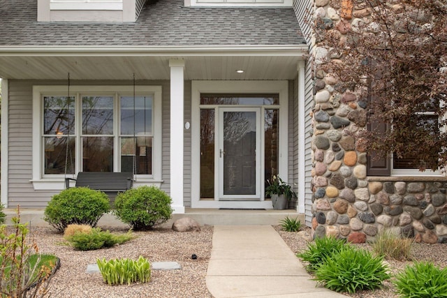 4633 Stonecliffe Dr, Eagan, MN 55122 - doorway to property with a shingled roof and covered porch