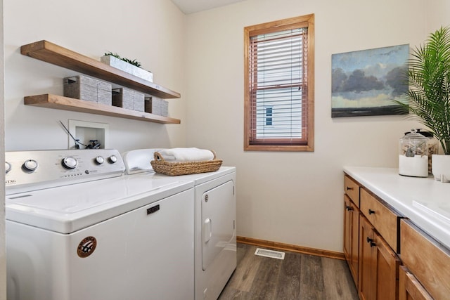 4633 Stonecliffe Dr, Eagan, MN 55122 - washroom with separate washer and dryer, dark wood-style flooring, and baseboards