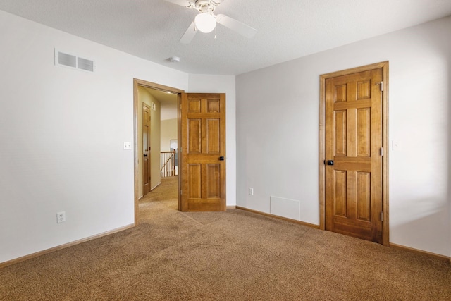 4633 Stonecliffe Dr, Eagan, MN 55122 - unfurnished bedroom featuring carpet flooring, baseboards, and a ceiling fan