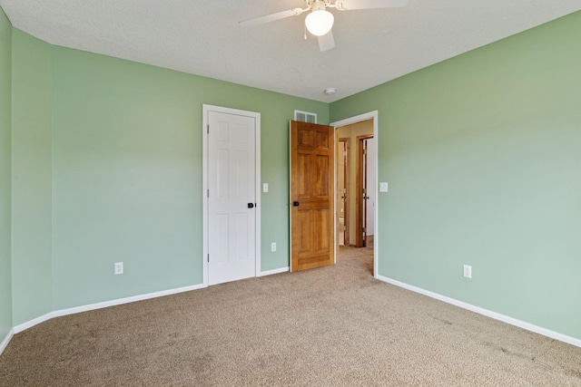 4633 Stonecliffe Dr, Eagan, MN 55122 - unfurnished bedroom featuring carpet floors, baseboards, and a ceiling fan