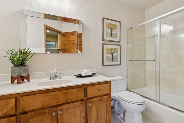 4633 Stonecliffe Dr, Eagan, MN 55122 - full bathroom with vanity, toilet, bath / shower combo with glass door, and tile patterned flooring