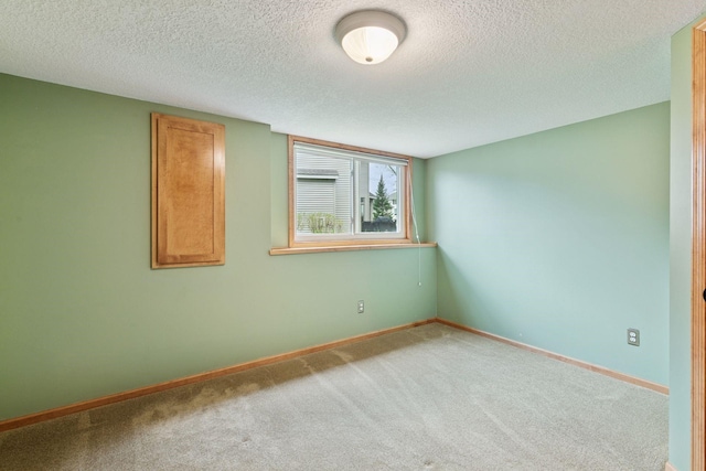 4633 Stonecliffe Dr, Eagan, MN 55122 - unfurnished room with carpet floors, a textured ceiling, and baseboards