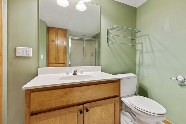 4633 Stonecliffe Dr, Eagan, MN 55122 - full bath with a shower stall, toilet, vanity, and a textured ceiling