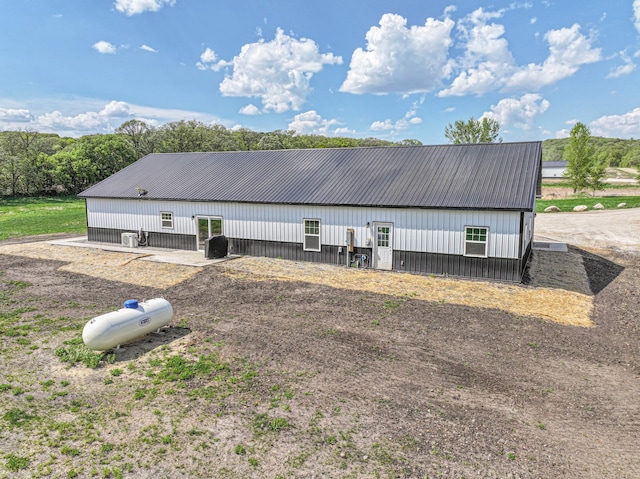 20462 Little Alps Rd NW, Evansville, MN 56326 - rear view of house with a pole building, metal roof, and an outbuilding