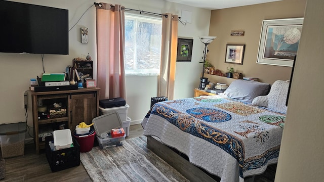 bedroom featuring wood finished floors
