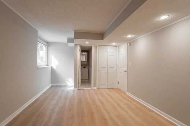 13100 Thomas Ave S, Burnsville, MN 55337 - spare room with crown molding, a textured ceiling, light wood finished floors, and recessed lighting
