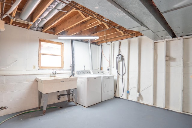 13100 Thomas Ave S, Burnsville, MN 55337 - below grade area with washing machine and dryer and concrete block wall