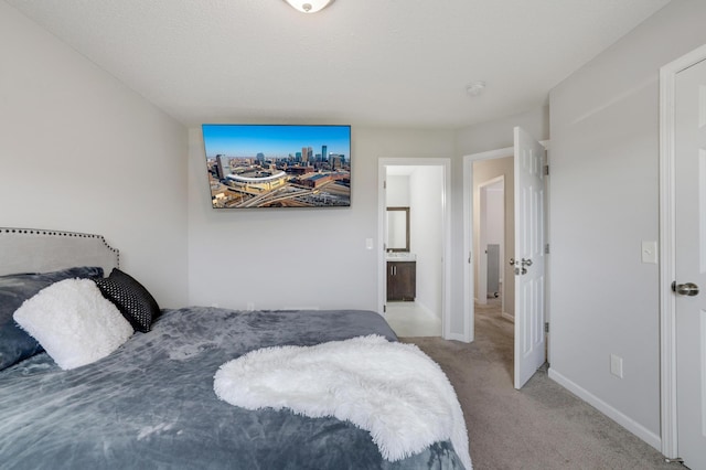 bedroom with baseboards and carpet flooring