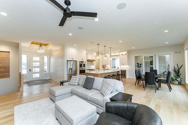 3251 Century Ridge Pl NE, Rochester, MN 55906 - living area with light wood-type flooring, a ceiling fan, and recessed lighting