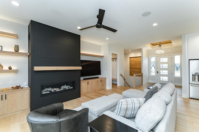 3251 Century Ridge Pl NE, Rochester, MN 55906 - living area with ceiling fan, recessed lighting, light wood finished floors, a fireplace, and baseboards
