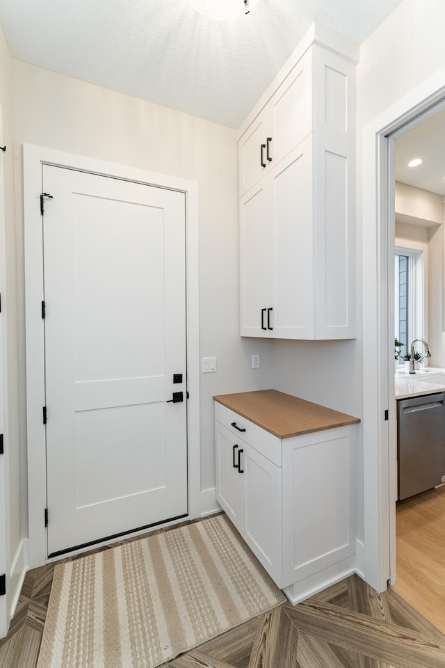 3251 Century Ridge Pl NE, Rochester, MN 55906 - doorway featuring baseboards, recessed lighting, and a sink
