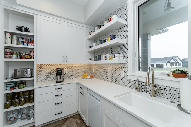 3251 Century Ridge Pl NE, Rochester, MN 55906 - kitchen with open shelves, a sink, dishwashing machine, white cabinetry, and backsplash