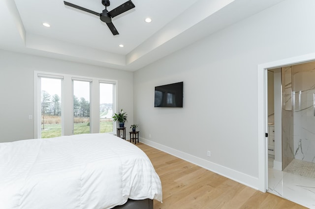 3251 Century Ridge Pl NE, Rochester, MN 55906 - bedroom featuring baseboards, light wood-style floors, recessed lighting, access to outside, and a tray ceiling