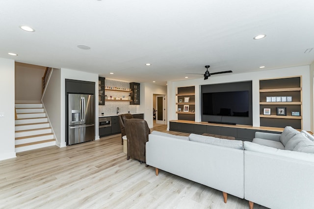 3251 Century Ridge Pl NE, Rochester, MN 55906 - living area with bar with sink, light wood-style floors, stairs, recessed lighting, and a ceiling fan