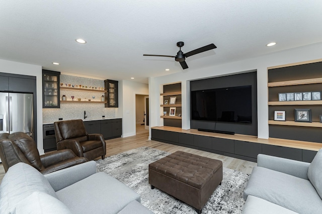 3251 Century Ridge Pl NE, Rochester, MN 55906 - living room featuring wet bar, ceiling fan, light wood-type flooring, built in shelves, and recessed lighting