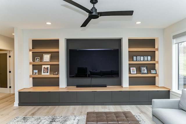 3251 Century Ridge Pl NE, Rochester, MN 55906 - living area featuring wood finished floors, ceiling fan, built in features, plenty of natural light, and recessed lighting