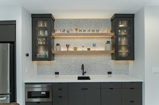 3251 Century Ridge Pl NE, Rochester, MN 55906 - indoor wet bar with appliances with stainless steel finishes and backsplash