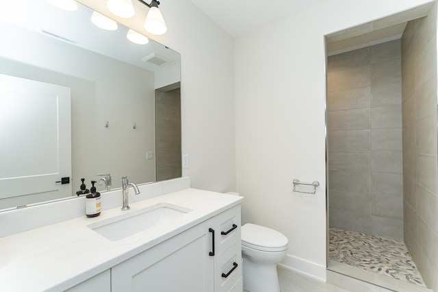 3251 Century Ridge Pl NE, Rochester, MN 55906 - bathroom featuring vanity, toilet, tiled shower, and tile patterned floors