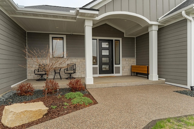 3251 Century Ridge Pl NE, Rochester, MN 55906 - property entrance featuring a porch, board and batten siding, and stone siding