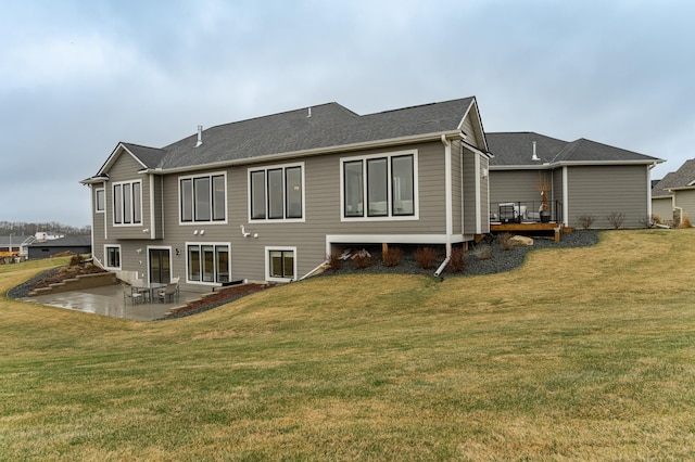 3251 Century Ridge Pl NE, Rochester, MN 55906 - back of property with a patio, a lawn, and a deck